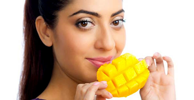 woman eating mango