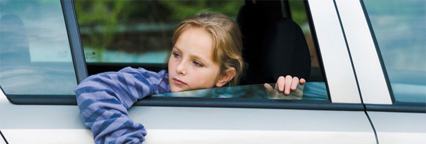 girl looking through car window