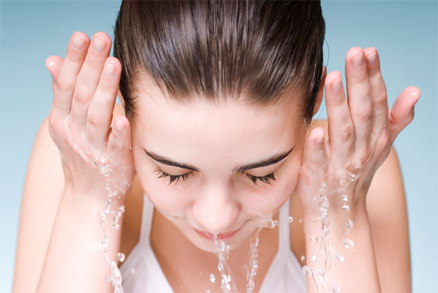 splashing water on face