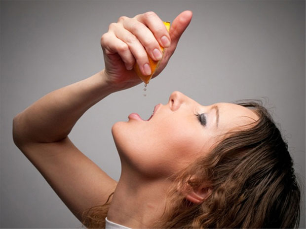 woman squeezing lemon