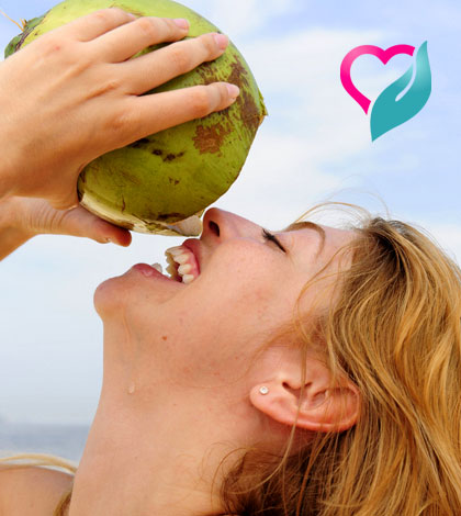 woman drinking coconut water