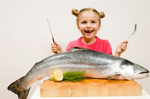 kid eating big fish