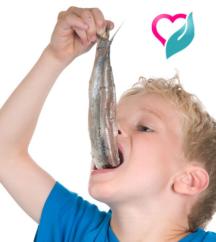 kid eating fish