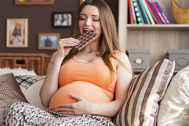 pregnancy girl eating chocolate